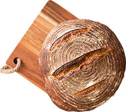 round loaf of bread on cutting board