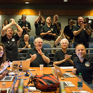 Part of the New Horizons team celebrating the spacecraft's flyby of Pluto.